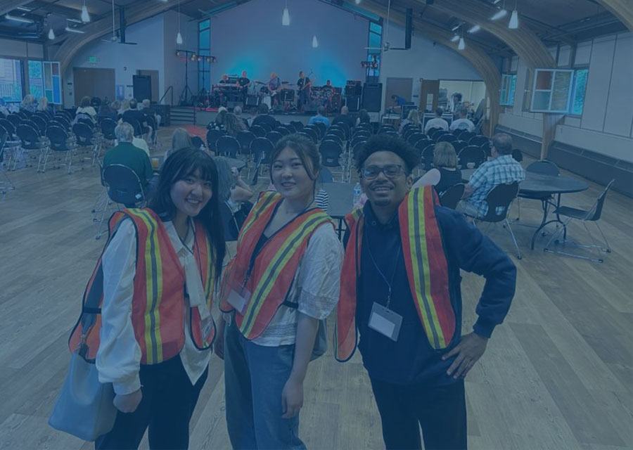 Three students in safety vest